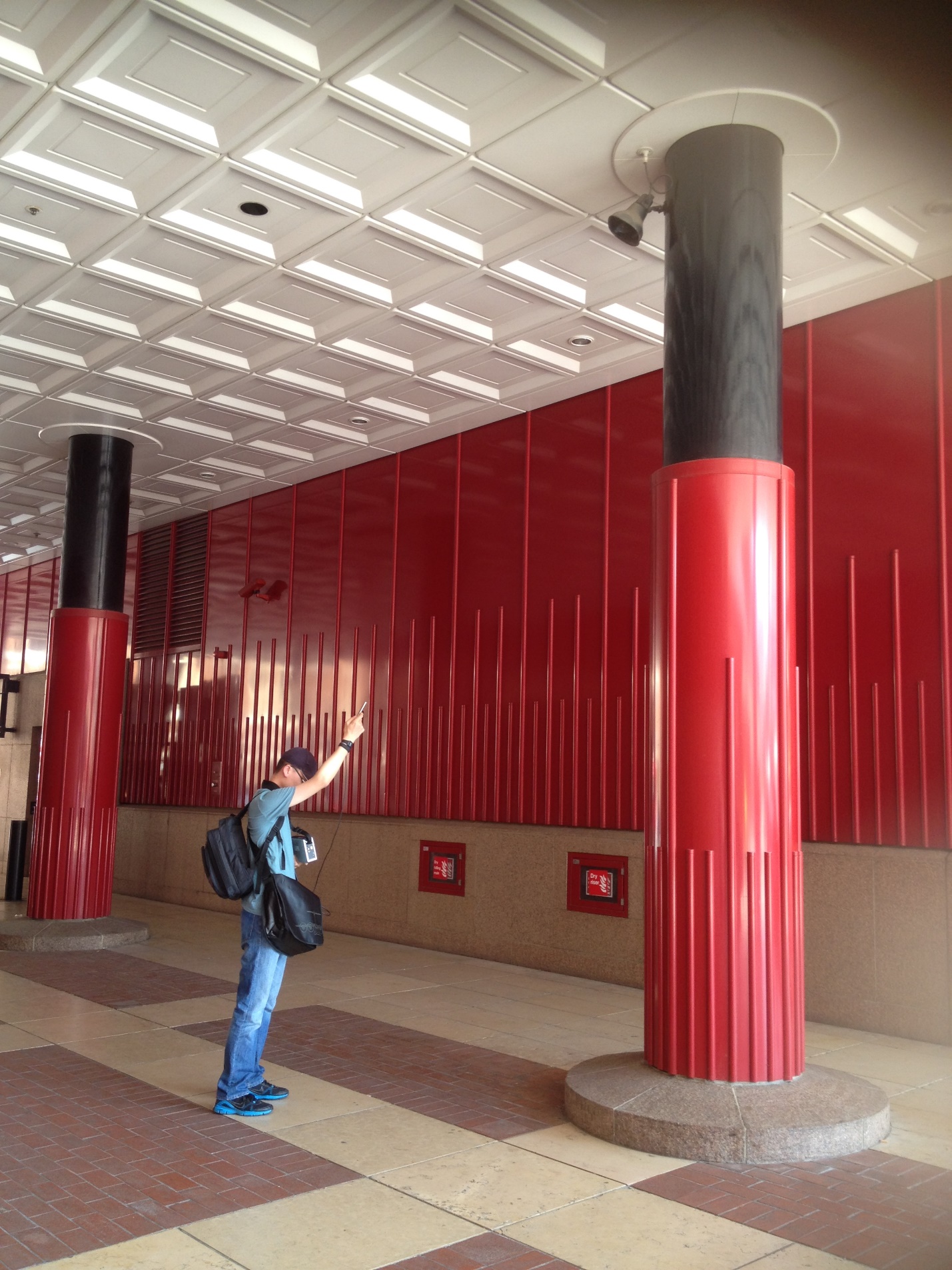 A person standing in a hallway
Description automatically generated